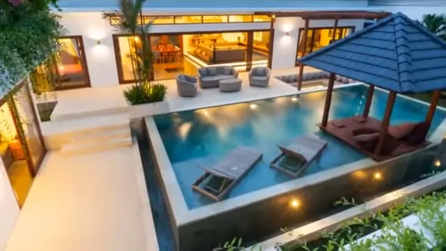 Outdoor pool and patio lighting in Charlotte NC with modern landscape lighting around home exterior