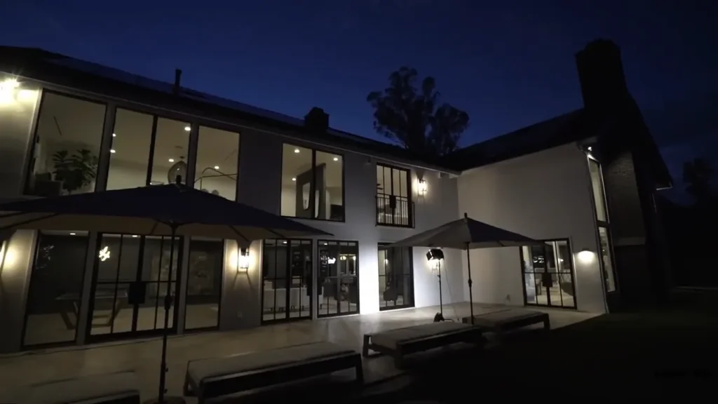 Beautiful front yard landscape lighting in Charlotte showing a warm and welcoming home exterior.